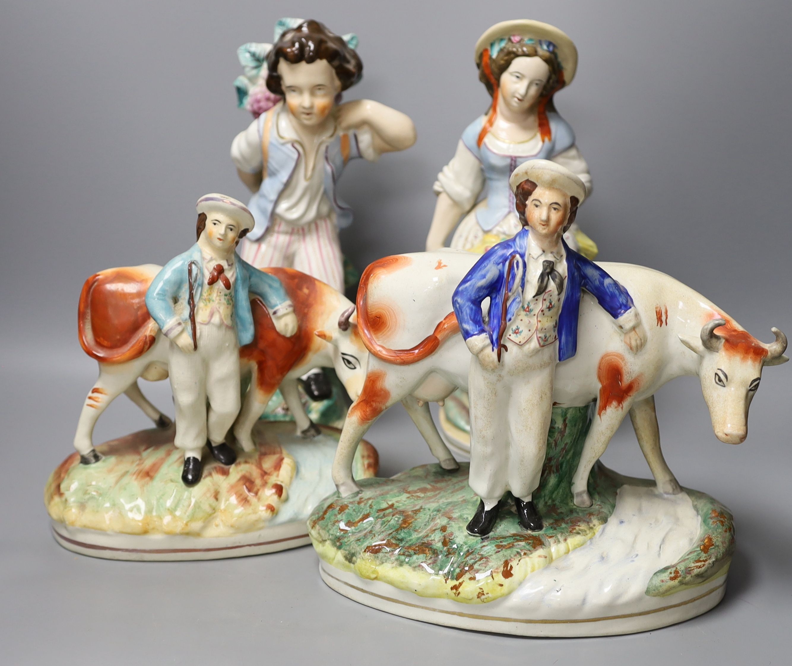 Assorted Staffordshire figures and a 'peck o' malt' jug - tallest 29cm